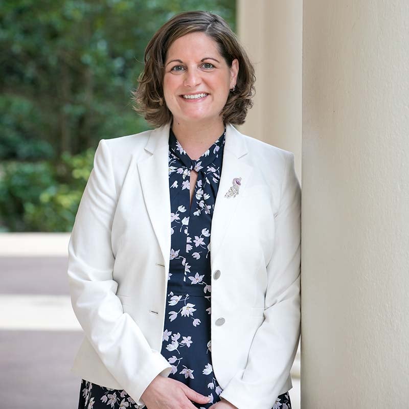 A female university researcher poses for a photo