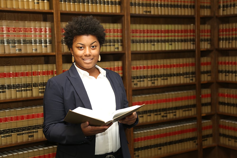 a young woman in a law library