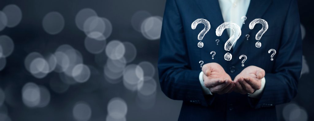 Businessman hand hold interface question marks